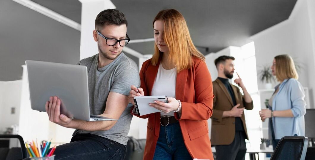 young-people-having-work-meeting-office_23-2148985452